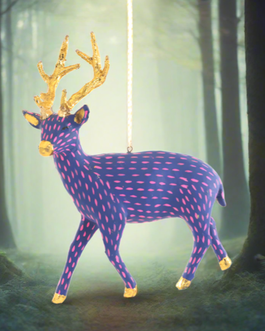 The Canton Christmas Shop Blue and Pink Paper Deer Ornament in magical woods at Christmas