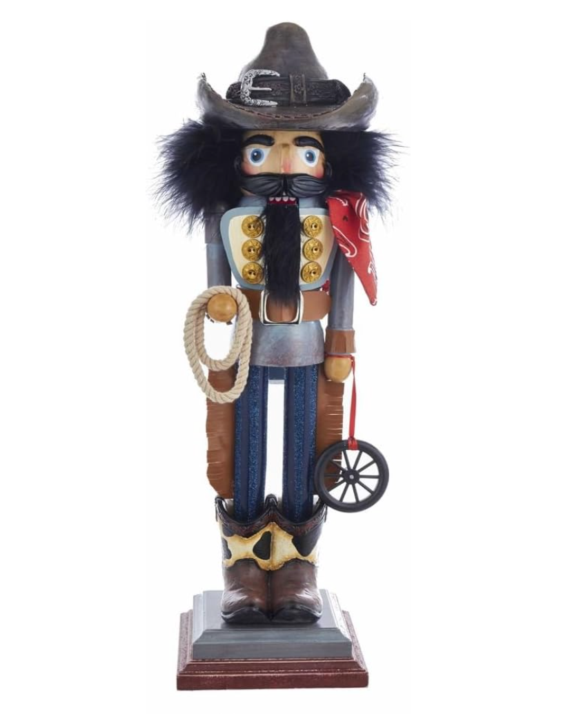 Nutcracker figurine dressed as a cowboy with a lasso and hat on a white background