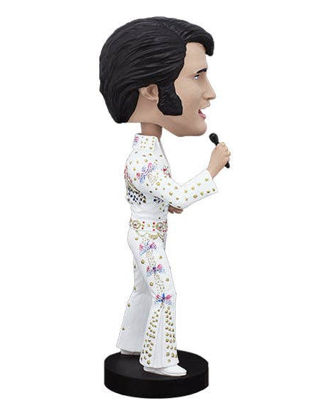 Christmas Cheer All Year Elvis Presley Hawaii concert bobblehead figurine in profile, wearing a white jumpsuit with colorful floral patterns and gold studs, holding a microphone on a black base against a white background