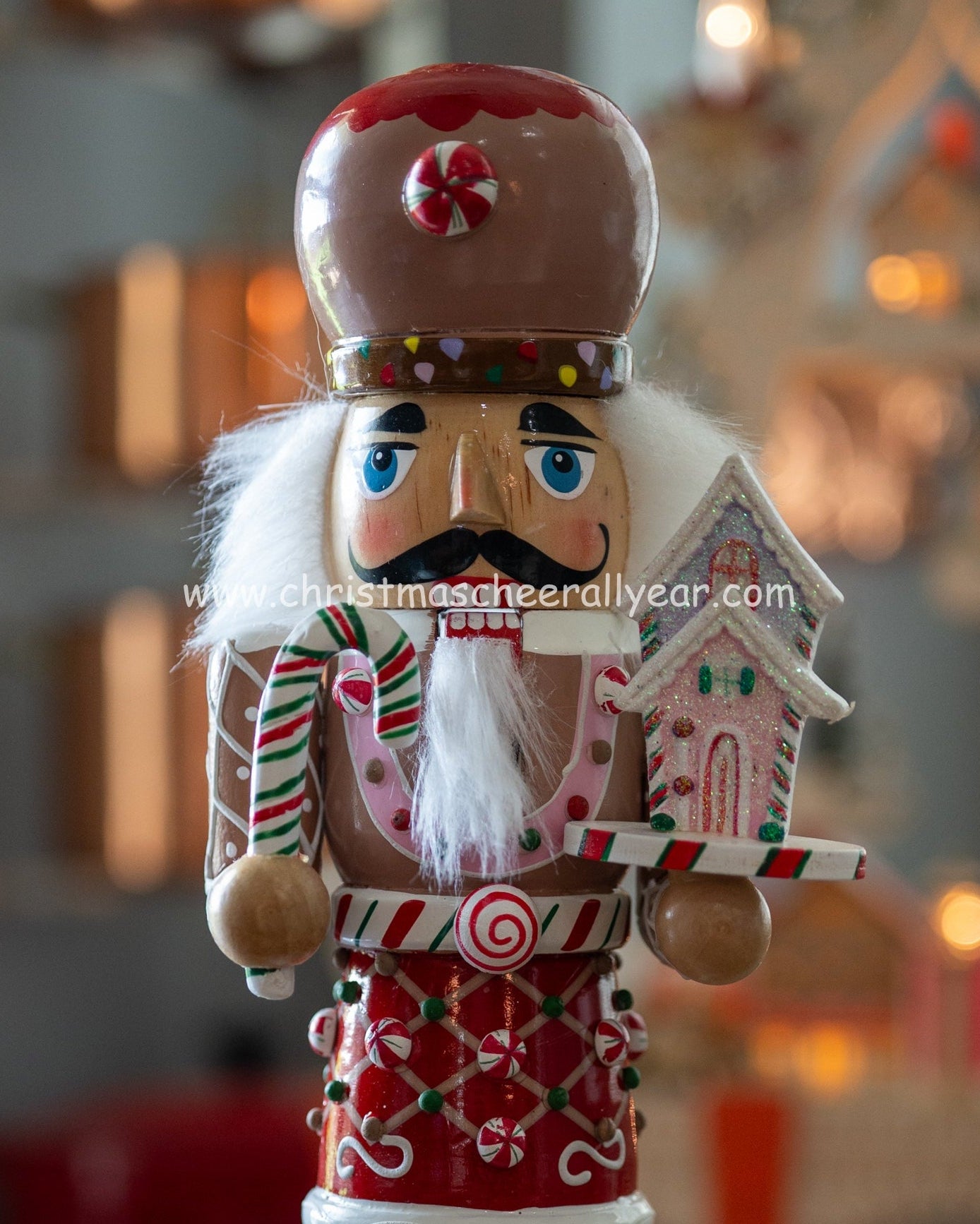 Christmas Cheer All Year Gingerbread Soldier Baker nutcracker with candy cane and gingerbread house and candy cane Kurt Adler