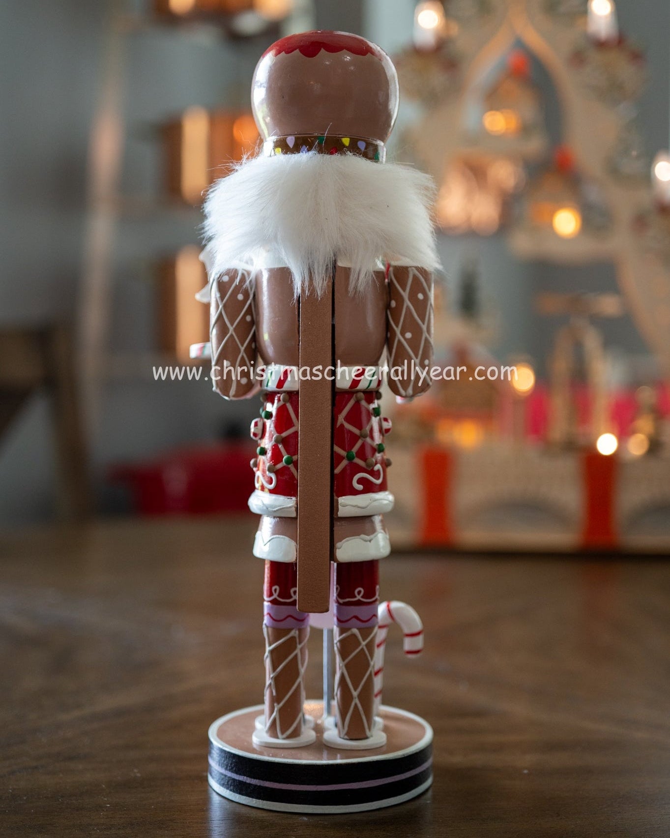 Christmas Cheer All Year Gingerbread Soldier Baker nutcracker with candy cane and gingerbread house and candy cane Kurt Adler