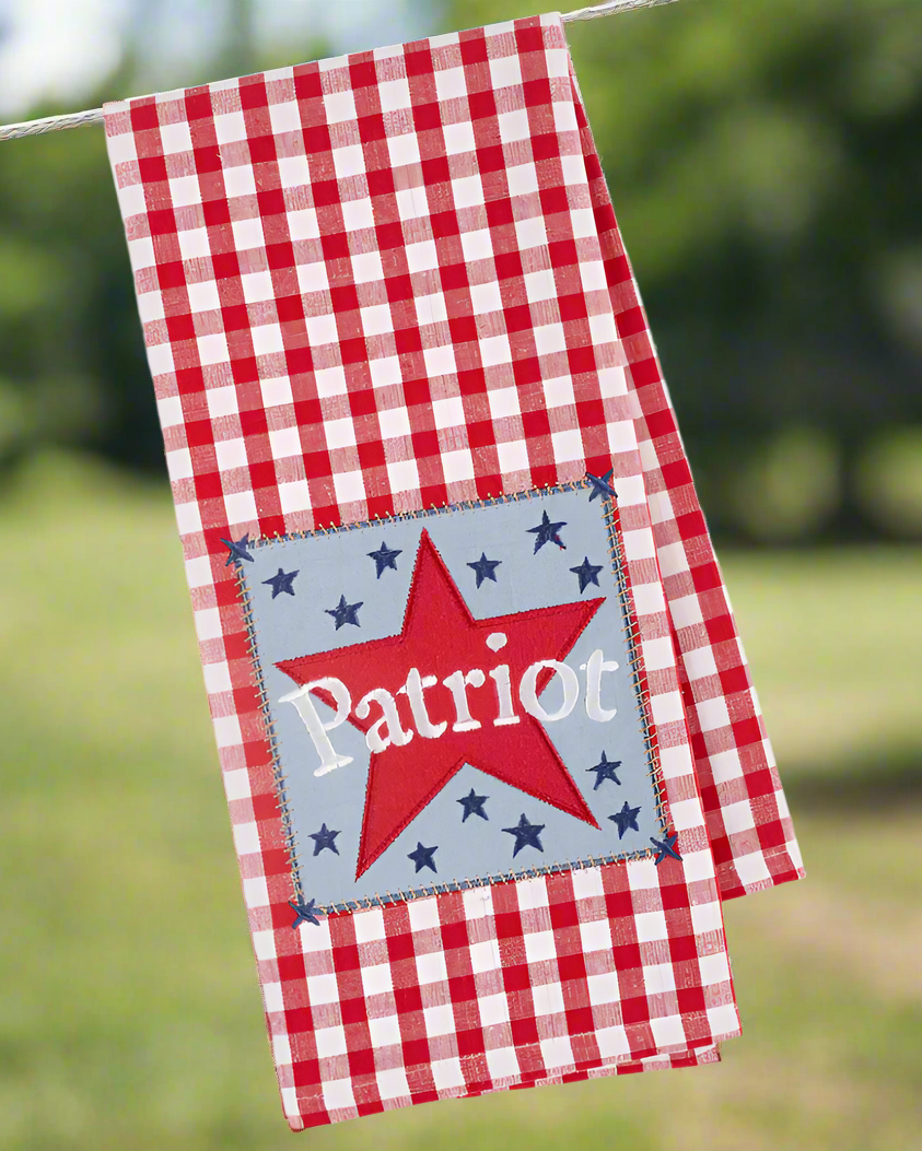 Christmas Cheer All Year Patriot Star Embellished Kitchen Towel hanging outside