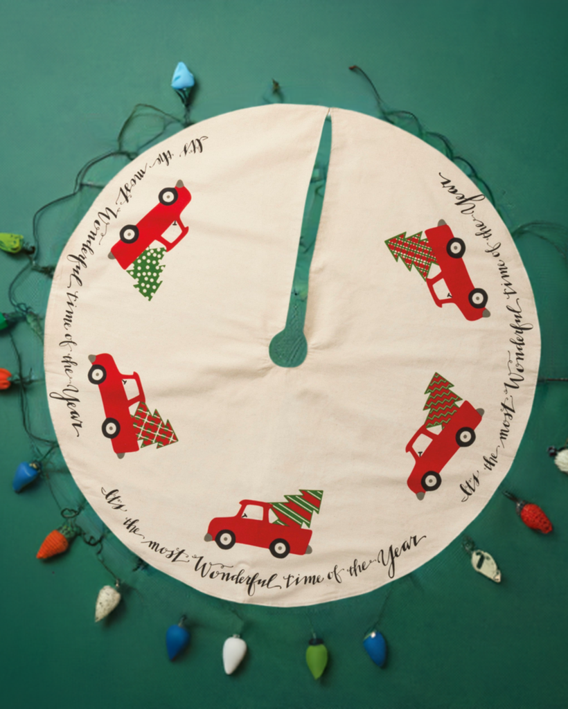 Christmas Cheer All Year Its the Most Wonderful Time of the Year Red Truck Tree Skirt Primitives by Kathy on green floor