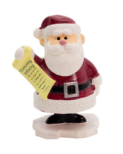 Rudolph the Red Nosed Reindeer TV show character Santa Claus figurine holding a yellow list