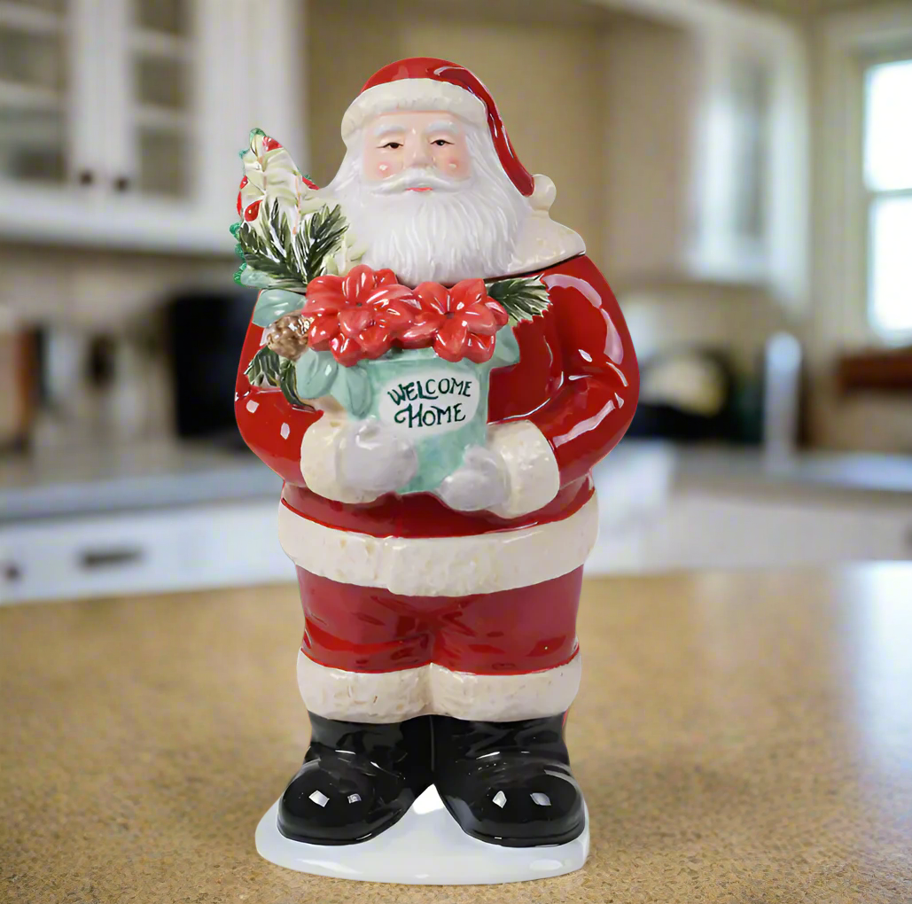 The Canton Christmas Shop Welcome Home Santa Cookie Jar Holding Poinsettia Flowers