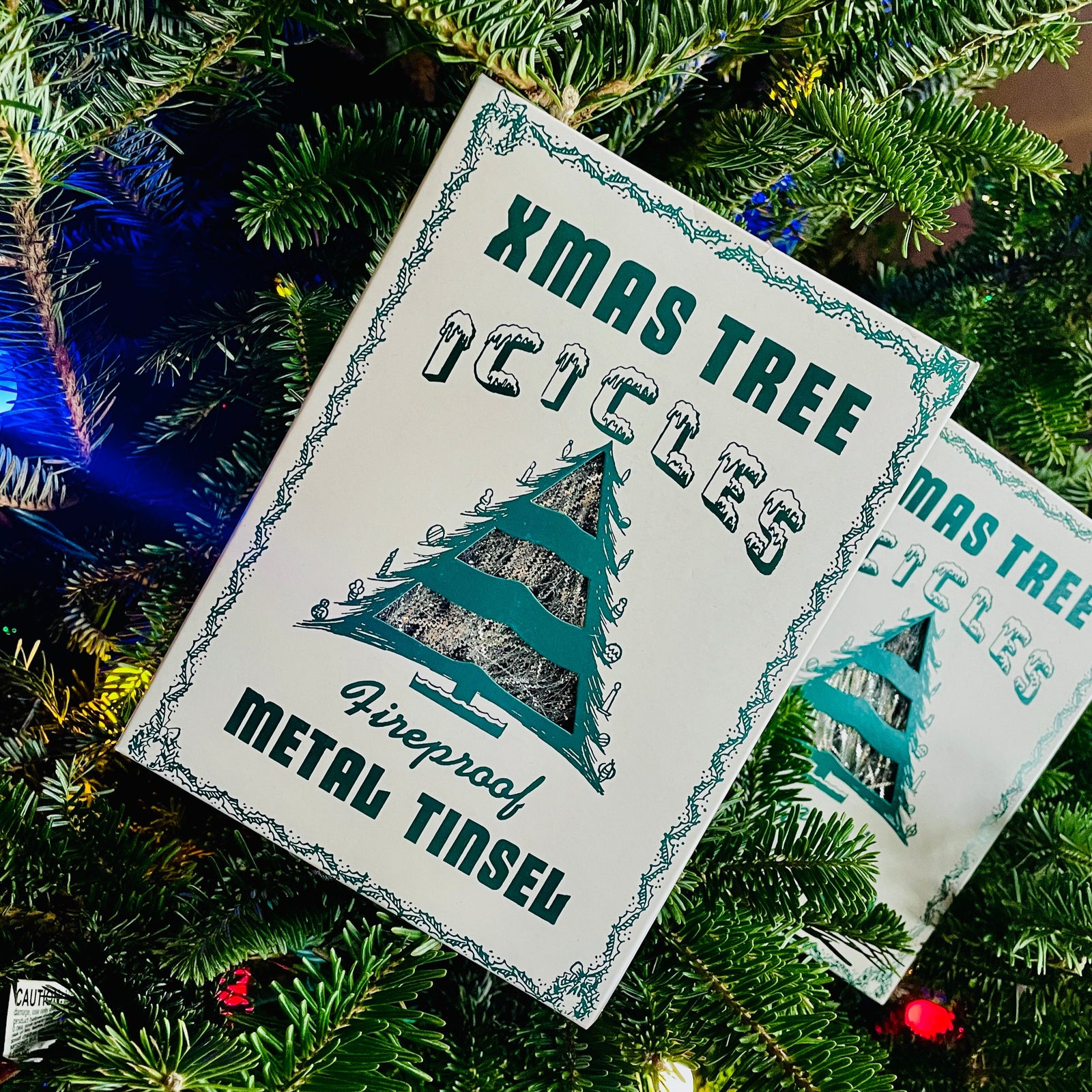 The Canton Christmas Shop Vintage Christmas Tree Icicles Fireproof metal Silver Tree Tinsel by Cody Foster