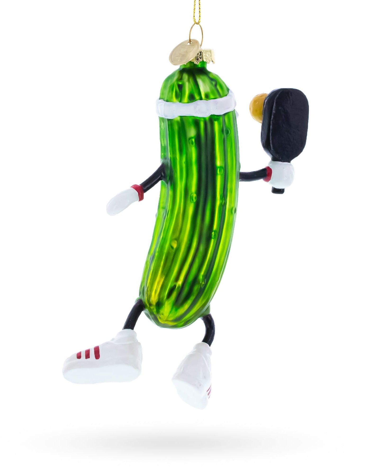 Decorative pickle ornament with arms, legs, and a face on a white background