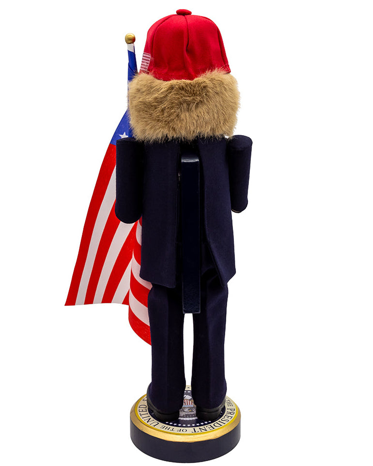 Christmas Cheer All Year Donald J. Trump Presidential Nutcracker Make America Great Again Red Baseball Cap Navy Suit American Flag on Pedestal by Kurt Adler G5013