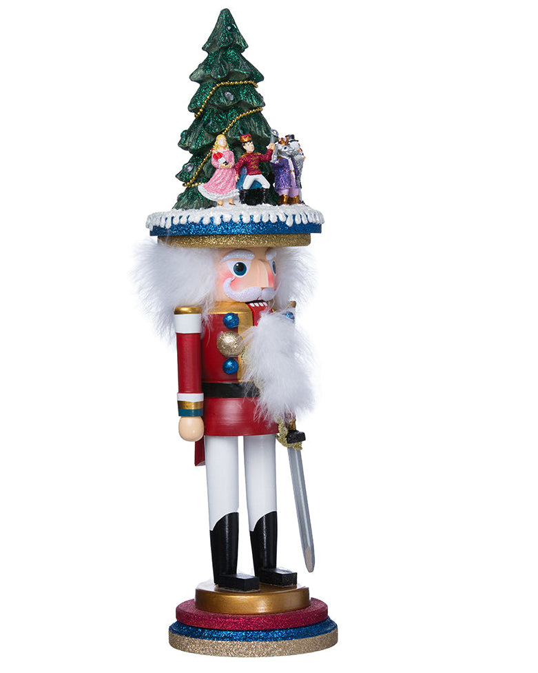 Decorative nutcracker figure with a Christmas tree and nutcracker ballet figures on a white background