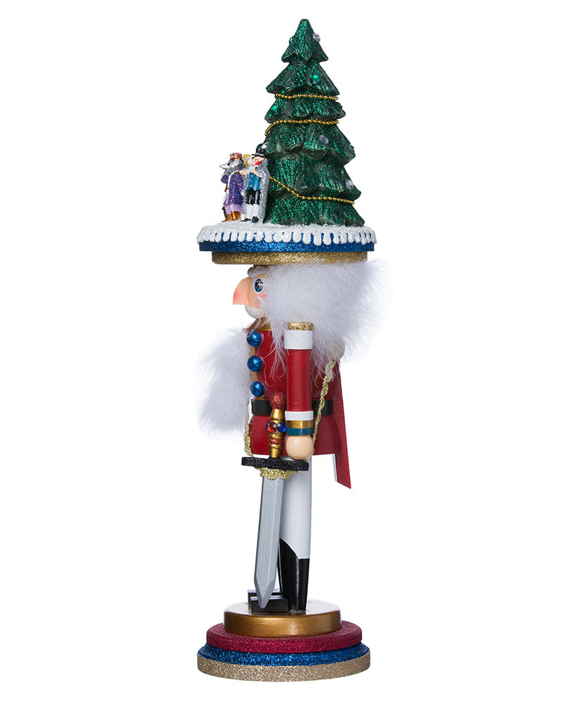 Decorative nutcracker with a Christmas tree and snowman on a white background