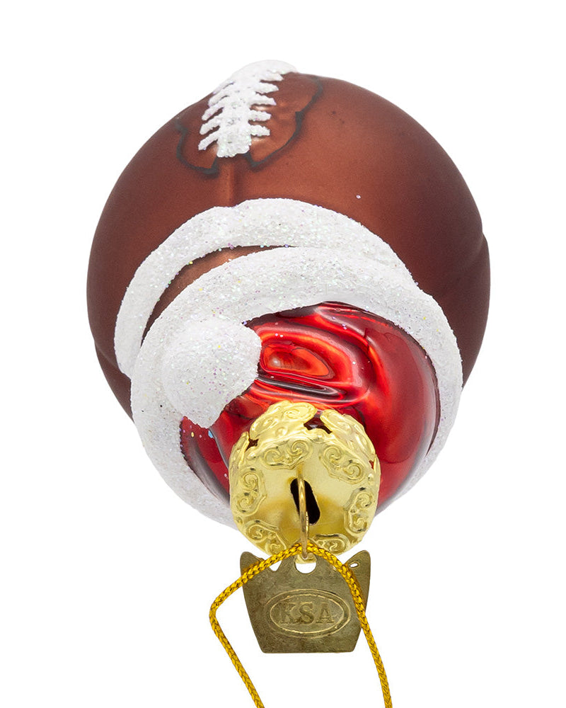 Christmas Cheer All Year Decorative football ornament with a gold bell on a white background