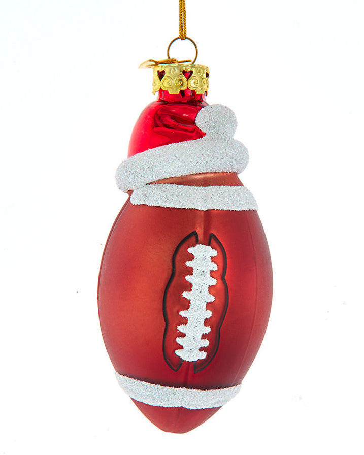 Christmas Cheer All Year Decorative football ornament with Santa hat on a white background