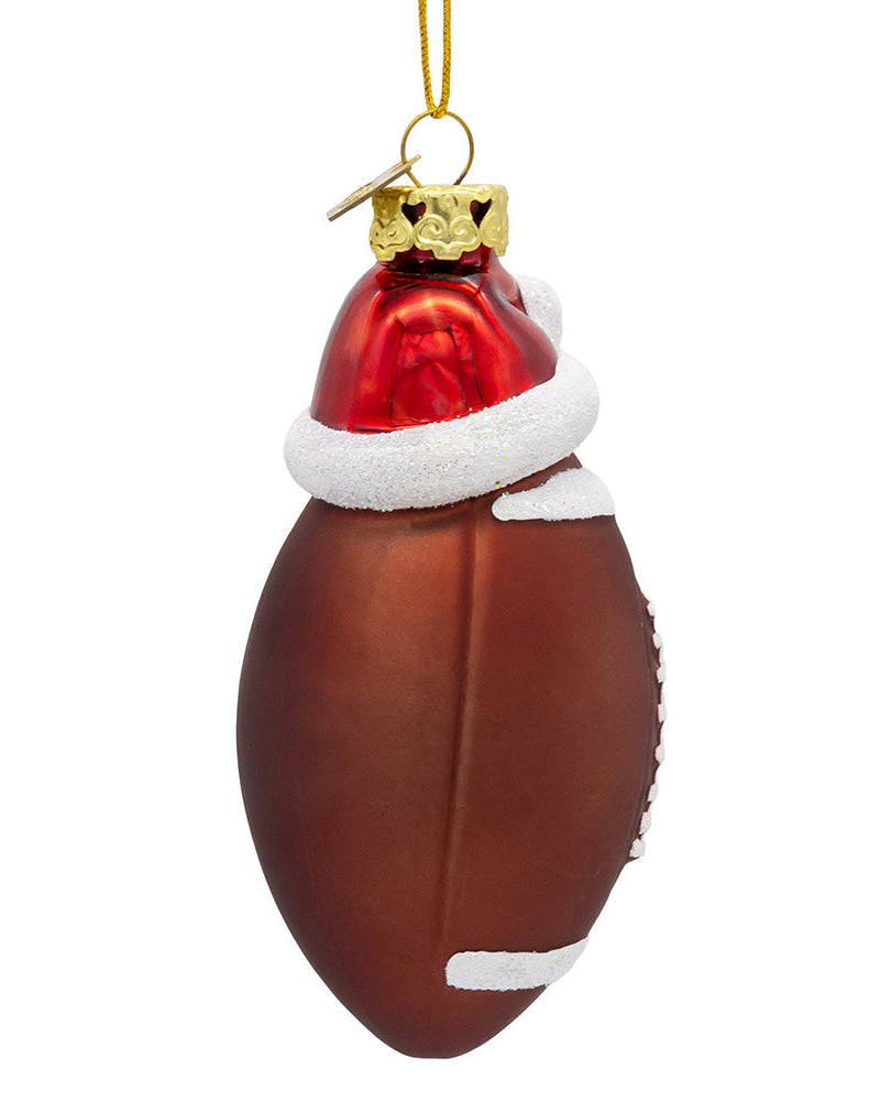 Christmas Cheer All Year Decorative football ornament with a Santa hat on a white background