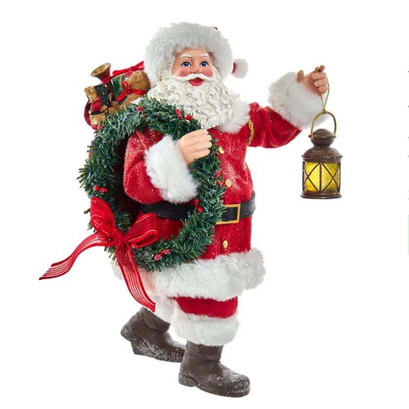 The Canton Christmas Shop 10.5" Fabriche Santa with wreath and lantern figurine by Kurt Adler