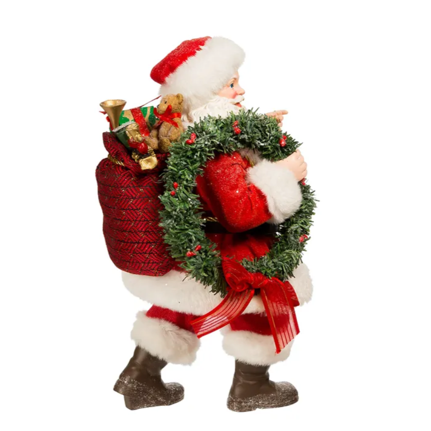 The Canton Christmas Shop 10.5" Fabriche Santa with wreath and lantern figurine by Kurt Adler