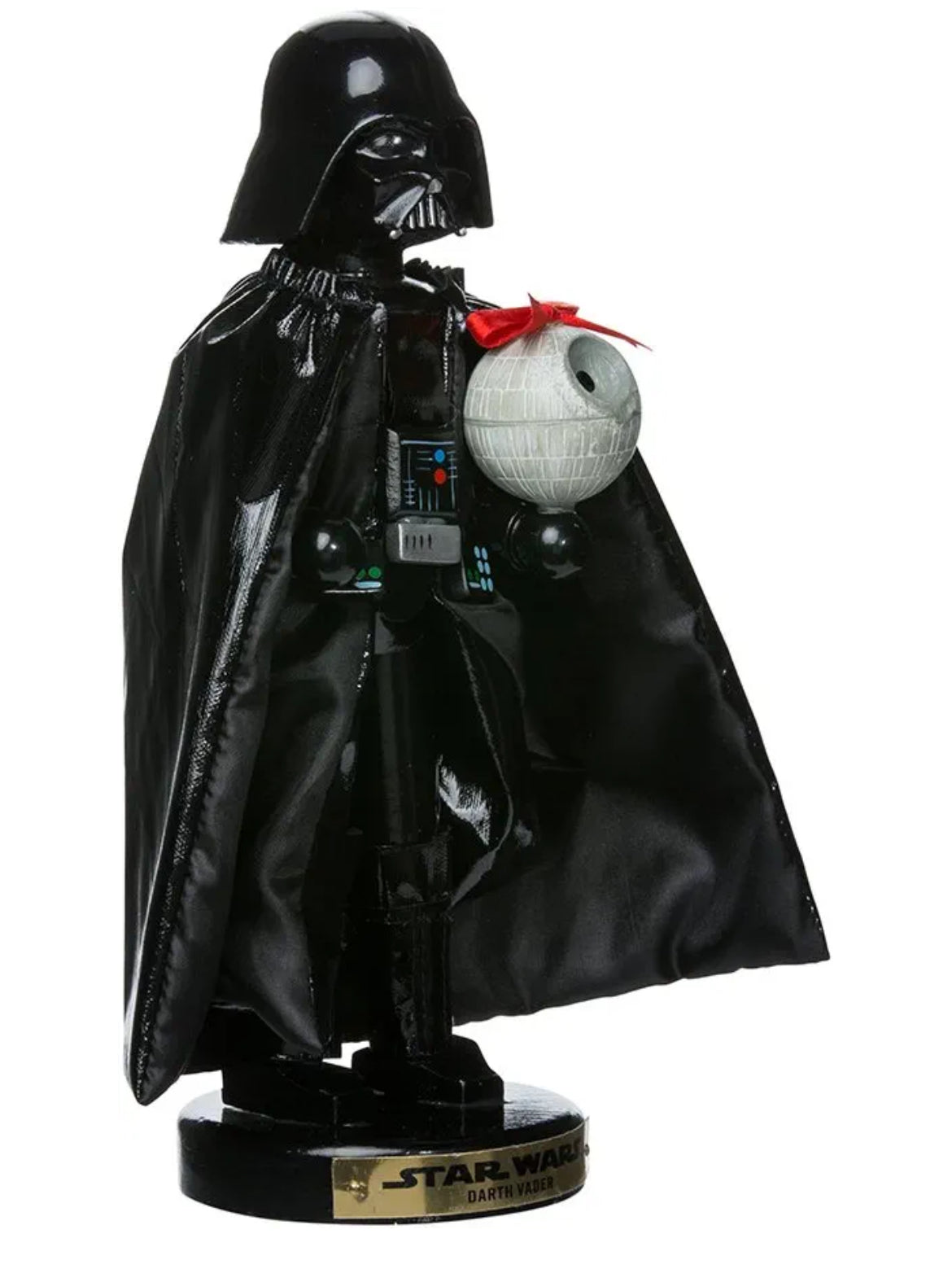 Christmas Cheer All Year A 10-inch tall Star Wars Darth Vader nutcracker figurine, featuring the character in his iconic black helmet and cape, holding a Death Star wrapped in a bow, standing on a base with a Star Wars logo from Kurt Adler