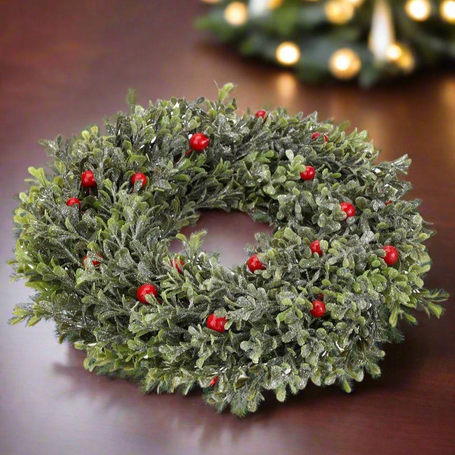 The Canton Christmas Shop 12" Frosted Boxwood with berries candle ring on dining room table