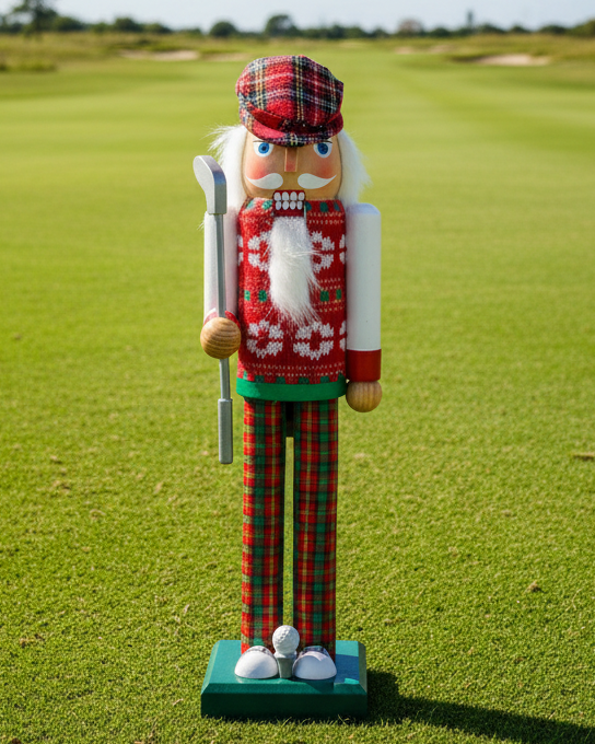 Christmas Cheer All Year 15" golf Nutcracker figurine dressed in a festive outfit with plaid hat, sweater and pants on a green base