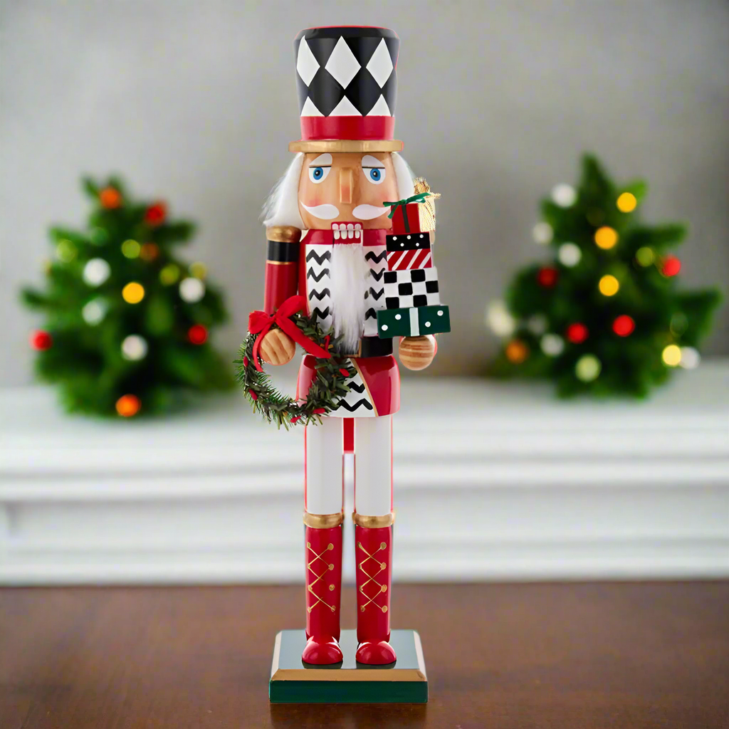 The Canton Christmas Shop 15" black and white harlequin nutcracker soldier with wreath and presents