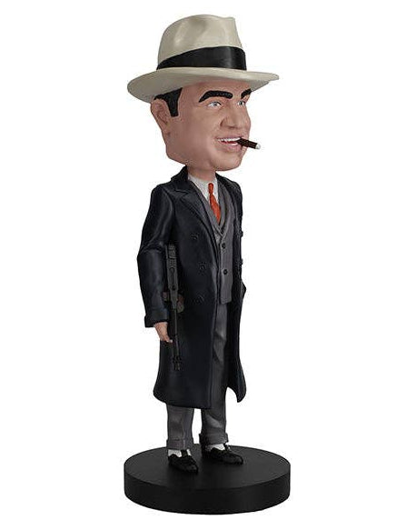 Christmas Cheer All Year American Gangster Bobblehead figure in formal attire with cigar in mouth beige fedora hat trench coat suit and tie and tommy gun standing on a black base that says Al Capone