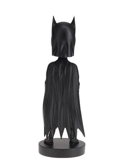Christmas Cheer All Year black Batman bobblehead figure shown from the back, featuring a cowl and cape on a round black base, isolated on a white background.