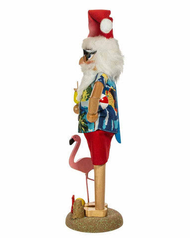 Kurt Adler Beach Santa Claus nutcracker in a tropical outfit with a flamingo on a white background