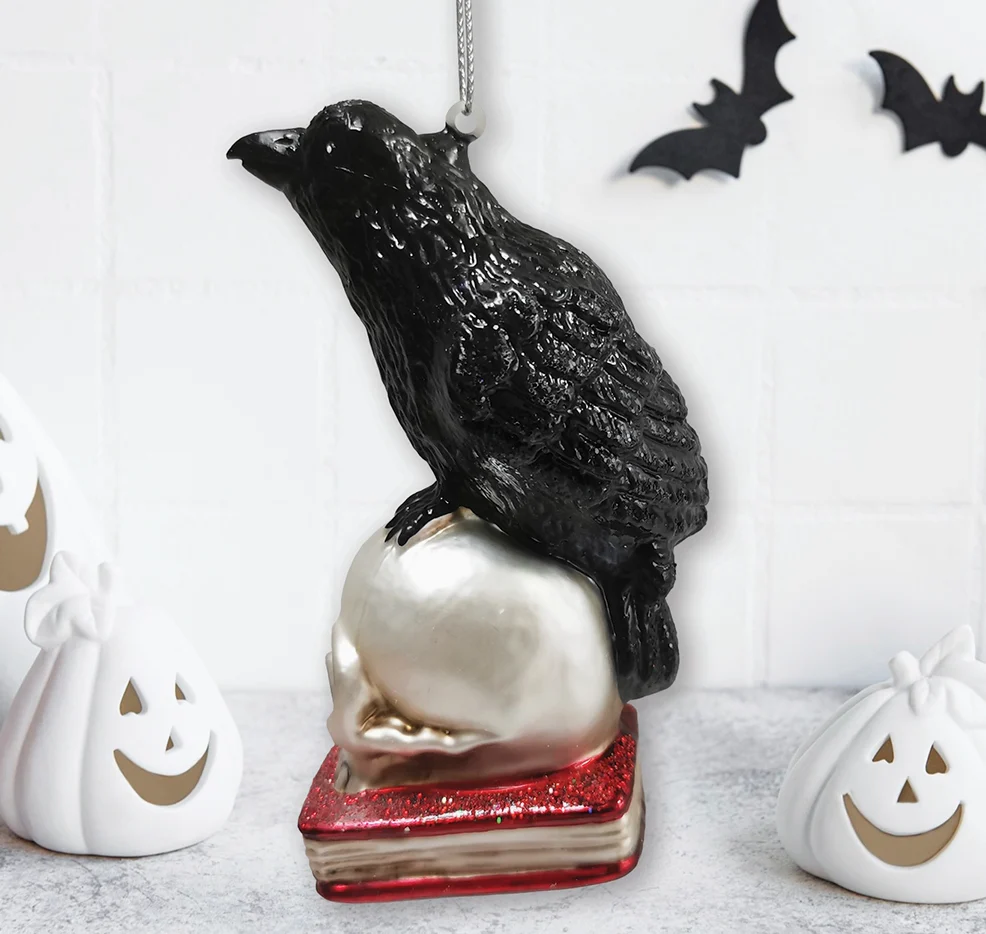 The Canton Christmas Shop Black Raven Perched on Skull on Glittered Book Ornament