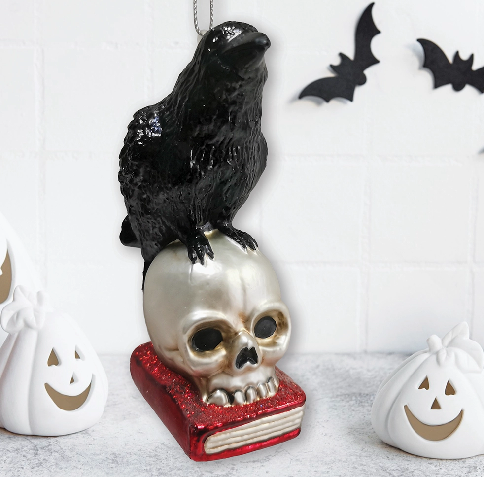 The Canton Christmas Shop Black Raven Perched on Skull on Glittered Book Ornament