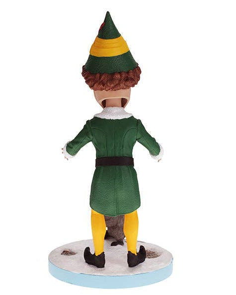 Christmas Cheer All Year Scene from Elf the Movie Bobblehead figure of Buddy the Elf in green and yellow elf costume and hat with a raccoon on base that says "does someone need a hug?"