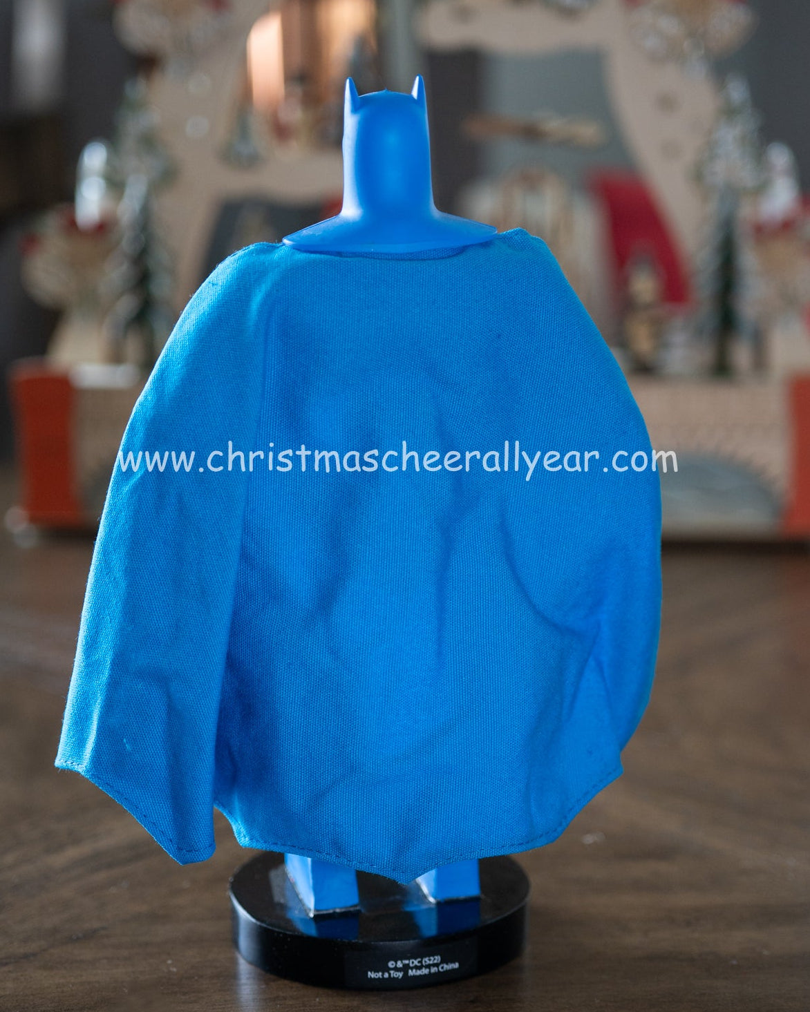 Christmas Cheer All Year DC Comics licensed Batman nutcracker by kurt adler on a wooden surface with a blurred background