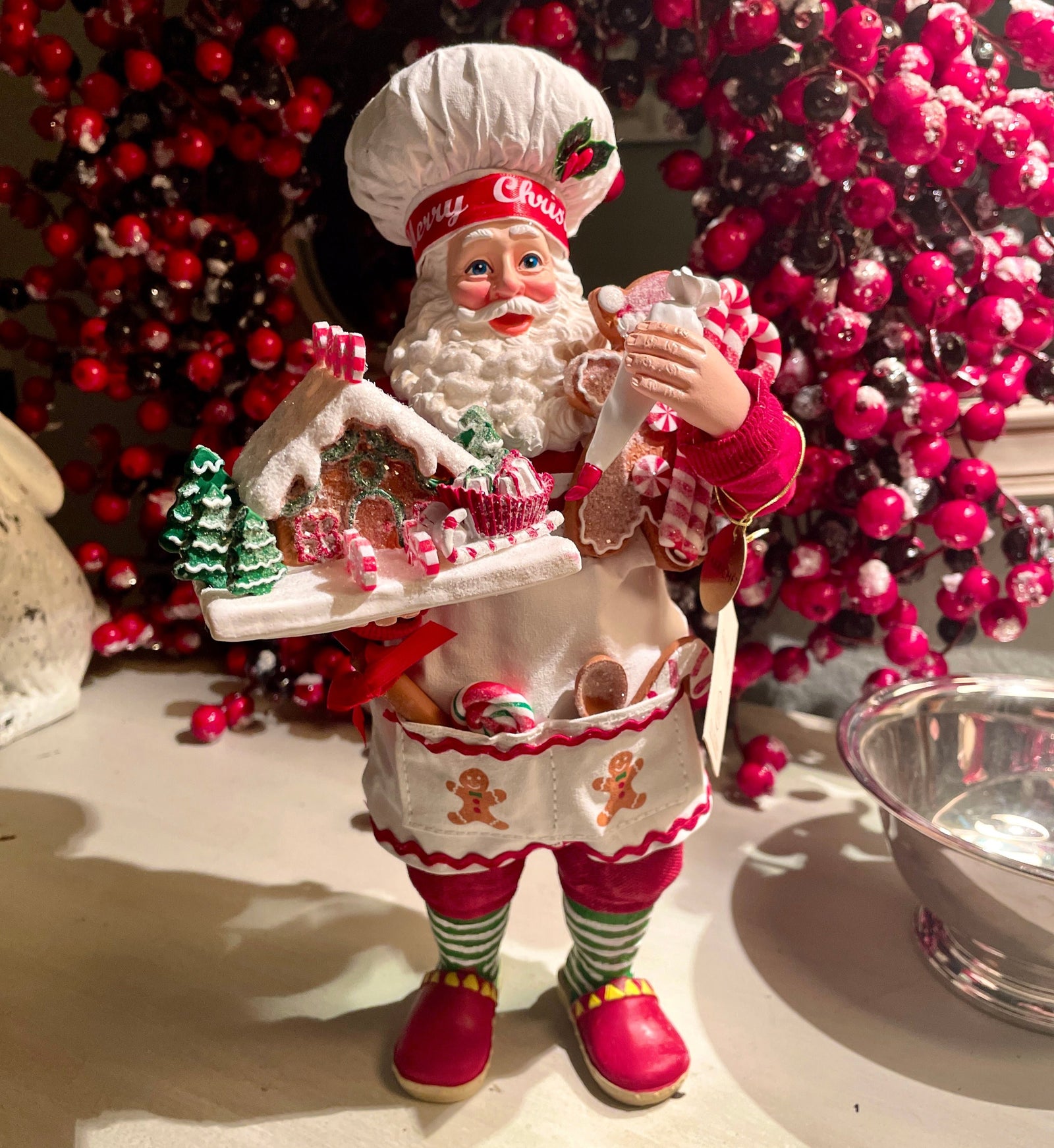 The Canton Christmas Shop 10.5" Fabriché™ Gingerbread Chef Santa with Gingerbread House and Piping Bag