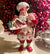 The Canton Christmas Shop 10.5" Fabriché™ Gingerbread Chef Santa with Gingerbread House and Piping Bag