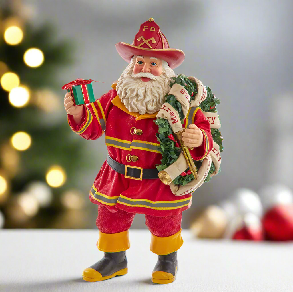 The Canton Christmas Shop Fabriche Santa Fireman with wreath and present figurine by Kurt Adler