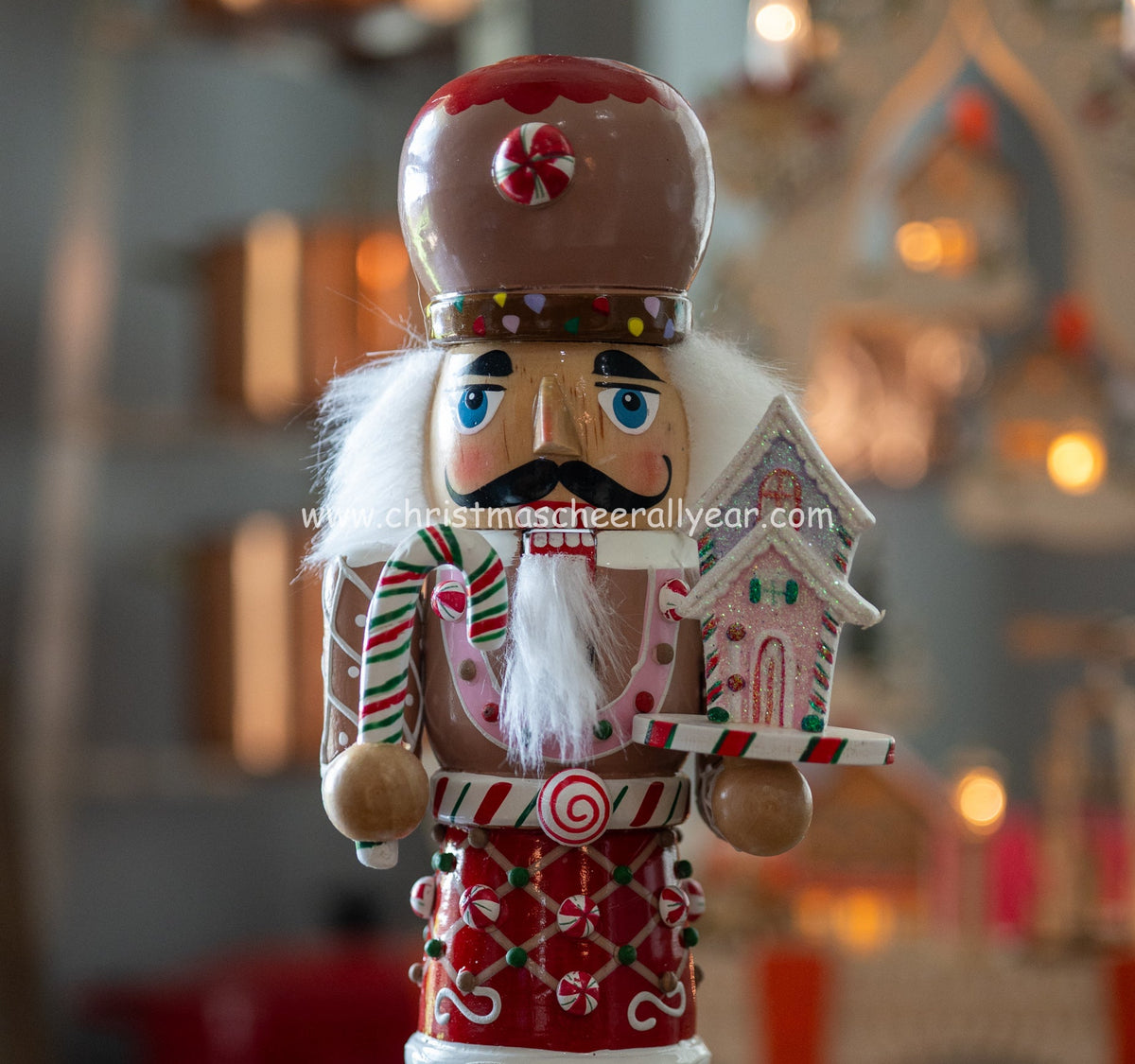 Christmas Cheer All Year Gingerbread Soldier Baker nutcracker with candy cane and gingerbread house and candy cane Kurt Adler 