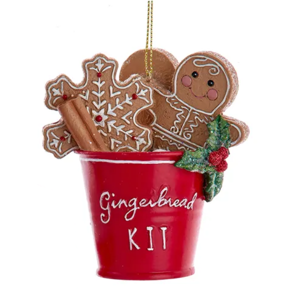 Christmas Cheer All Year Decorative ornament with gingerbread cookies, a red bucket labeled 'Gingerbread Kit', and a sprig of holly 