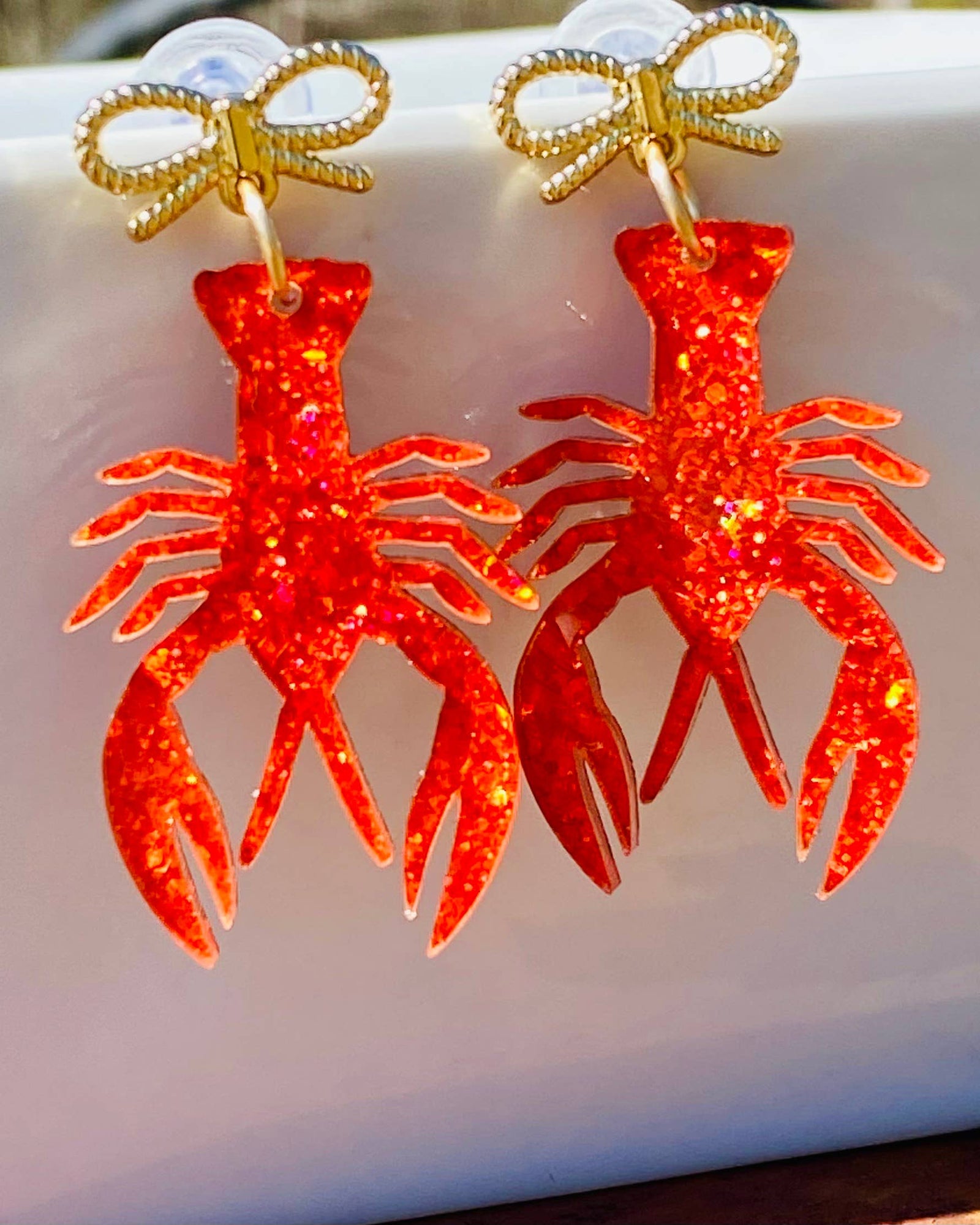 Amanda Bright Designs Gold Bow with red sparkly crawfish acrylic drop earrings