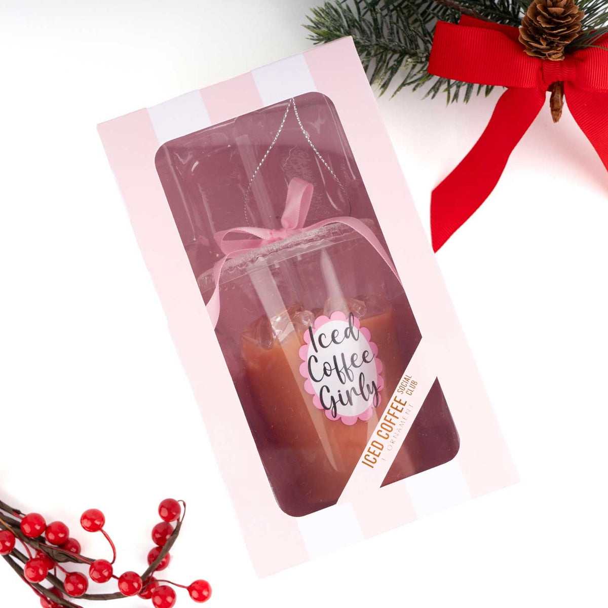 Christmas Cheer All Year Packaged Iced Latte Ornament with 'Iced Coffee Girly' text, surrounded by Christmas decorations on a white background
