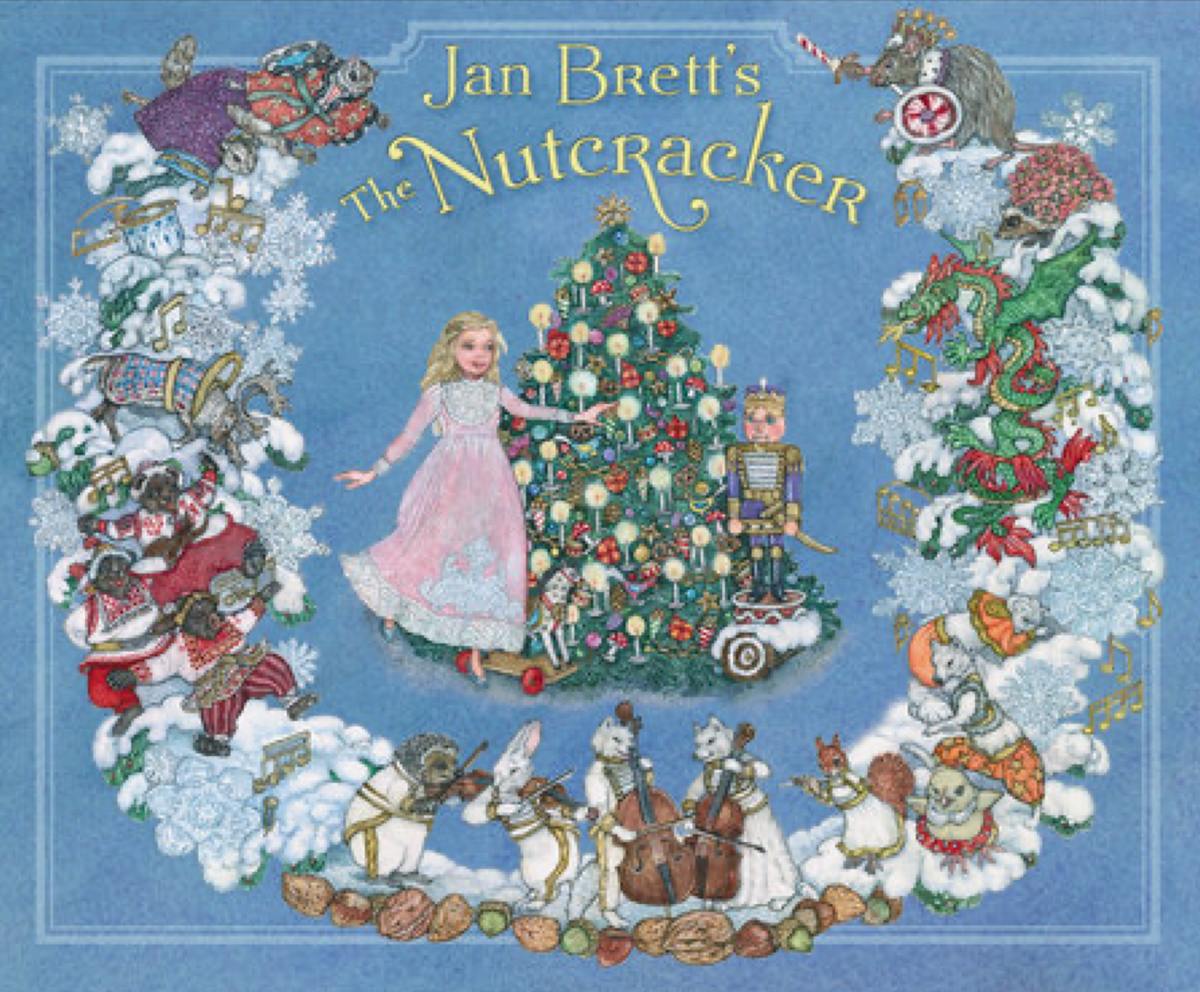 Illustrated book cover of &#39;The Nutcracker&#39; by Jan Brett with characters and a Christmas tree on a blue background a retelling of the Nutcracker Suite Ballet story Christmas Cheer All Year