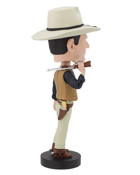 Christmas Cheer All Year John Wayne Bobblehead in a cowboy outfit holding a gun with holster on a white background