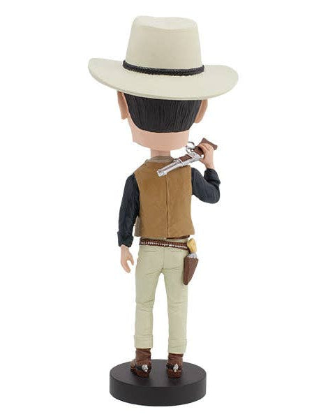 Christmas Cheer All Year John Wayne Bobblehead in a cowboy outfit holding a gun with holster on a white background