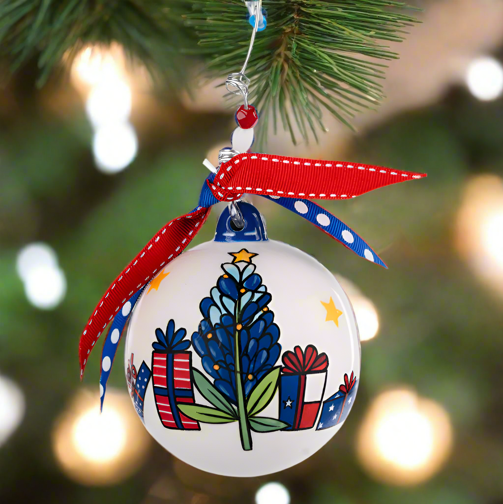 The Canton Christmas Shop Merry Texmas Bluebonnet Ornament with Texas flag red and blue ribbon yellow stars