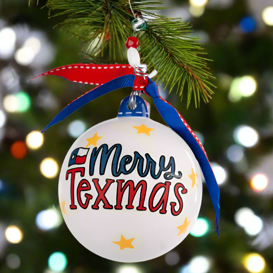 The Canton Christmas Shop Merry Texmas Bluebonnet Ornament with Texas flag red and blue ribbon yellow stars