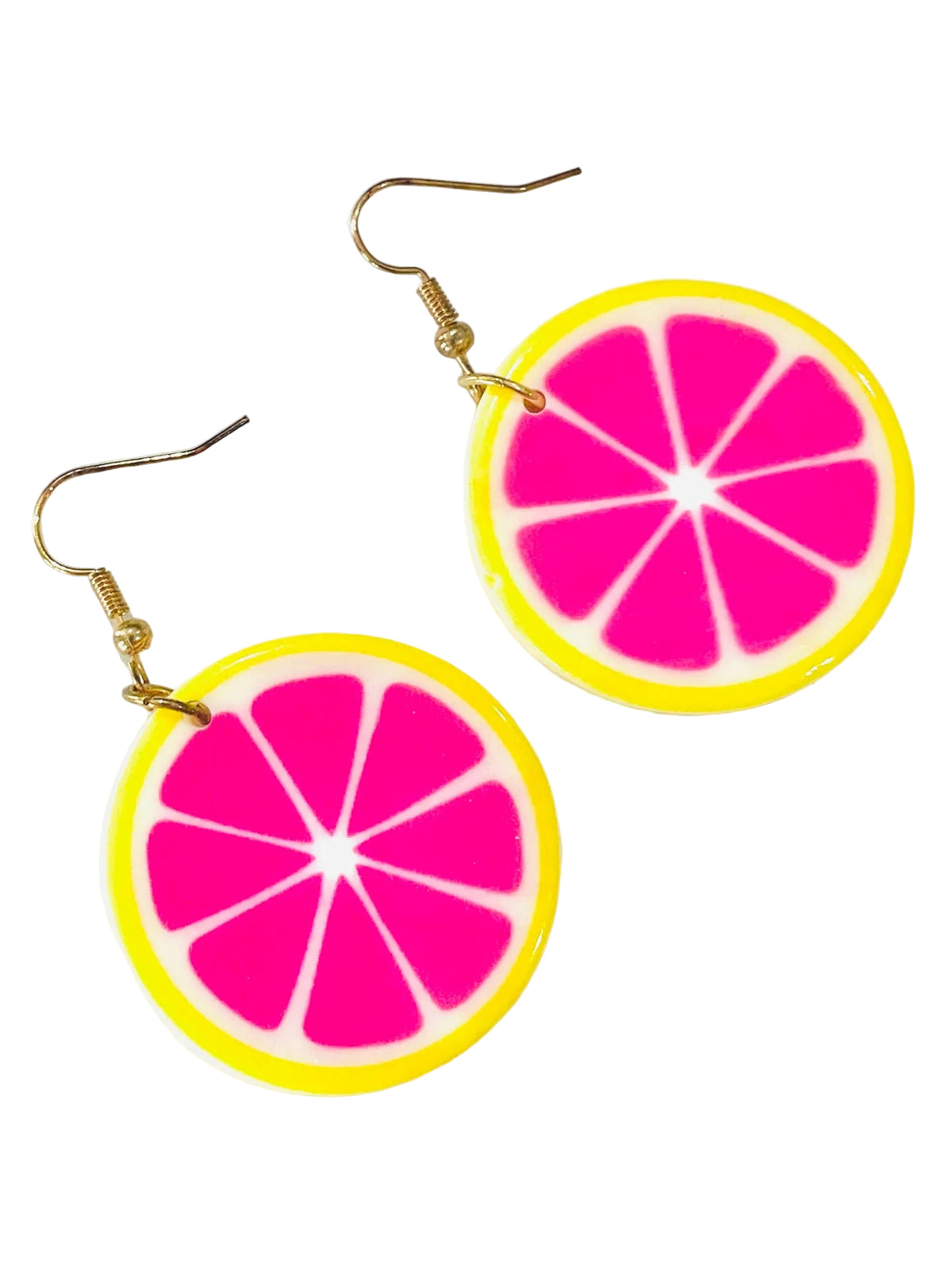 Christmas Cheer All Year pair of round dangle earrings designed to look like bright pink grapefruit slices with yellow rinds, hanging from gold-tone fishhook wires on a white background.