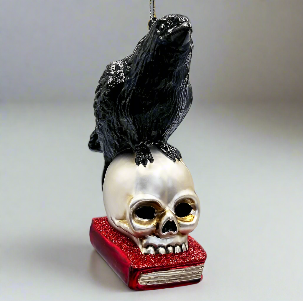 The Canton Christmas Shop Black Raven Perched on Skull on Glittered Book Ornament