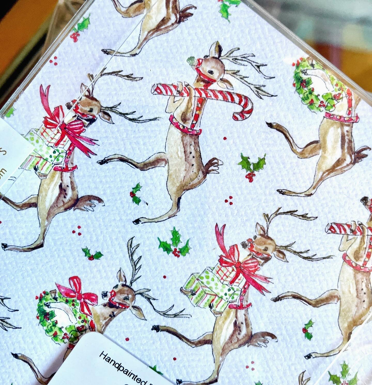 The Canton Christmas Shop Handpainted Dancing Reindeer Square Coaster close up view of back