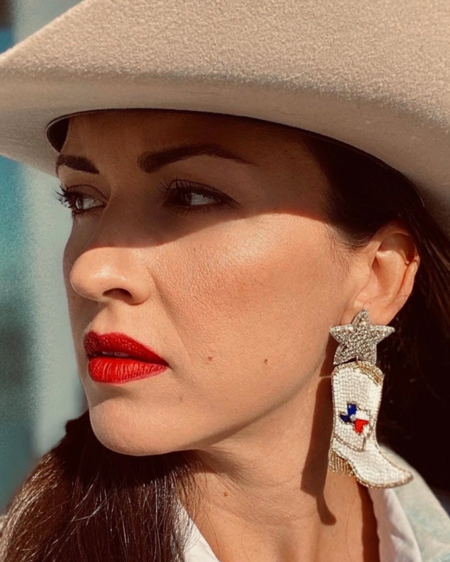 Christmas Cheer All Year State of Texas Cowboy Star Beaded and Jeweled Red White Blue and Gold Cowboy Boot Earrings on model