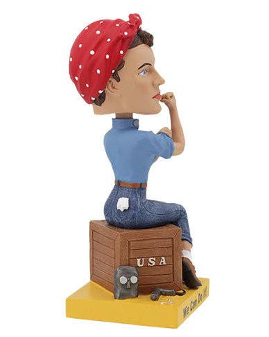 Christmas Cheer All Year Rosie the Riveter Bobblehead figure of a woman with a red bandana and blue shirt, sitting on a box with 'USA' and 'We Can Do It!' text.
