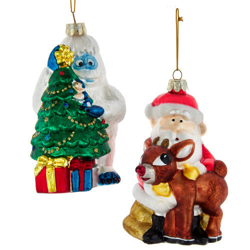 Two Christmas-themed ornaments: one with Bumble by a tree and presents, and another with Santa Claus and a reindeer.