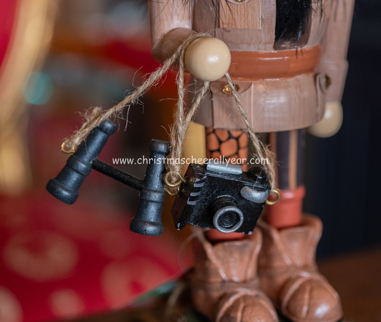 Kurt Adler Safari Nutcracker figurine with safari hat and animal details, available at Christmas Cheer All Year online store