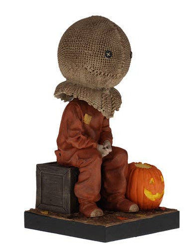 Christmas Cheer All Year Halloween Movie Sam Trick 'r' treat film Bobblehead figure of a character with a burlap sack on his head and pumpkin at his feet 